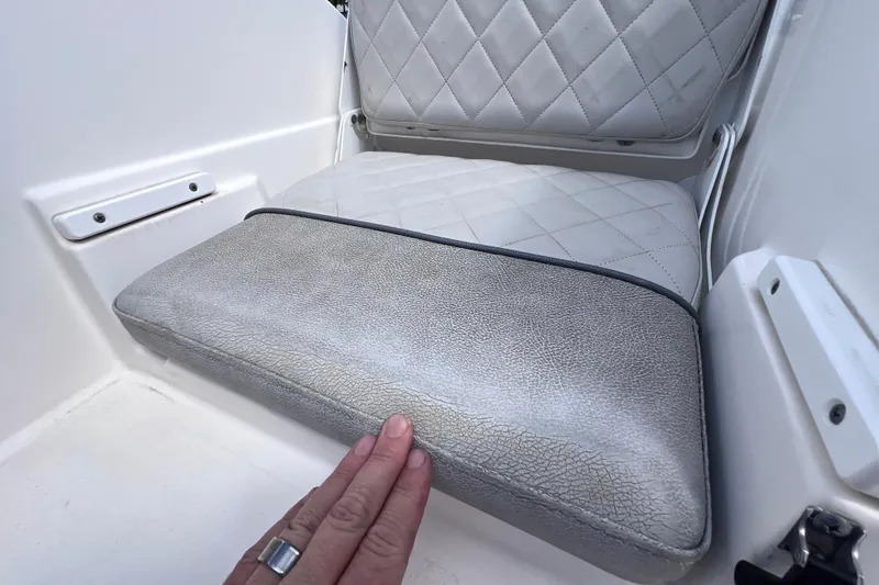 Slide: The Image of Cushioned seat detail on 2019 Sea Fox 328 Commander boat, featuring diamond stitching. - 82