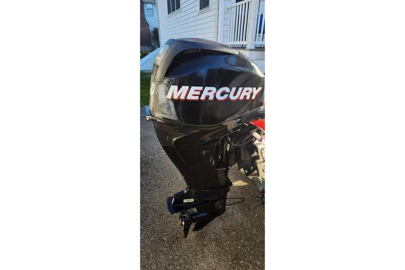 Slide: The Image of Mercury outboard motor on a 2011 Boston Whaler 130 Super Sport boat. - 7