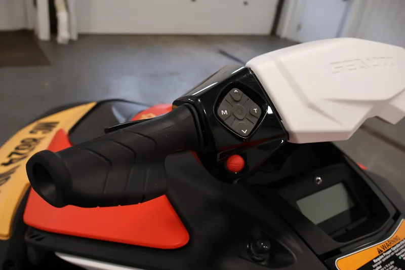 Slide: The Image of Handlebar controls of 2025 Sea-Doo Spark 2up, featuring ergonomic grip and control buttons. - 10