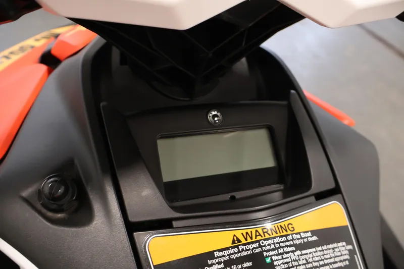 Slide: The Image of Dashboard of 2025 Sea-Doo Spark 2up with warning label and display screen. - 11