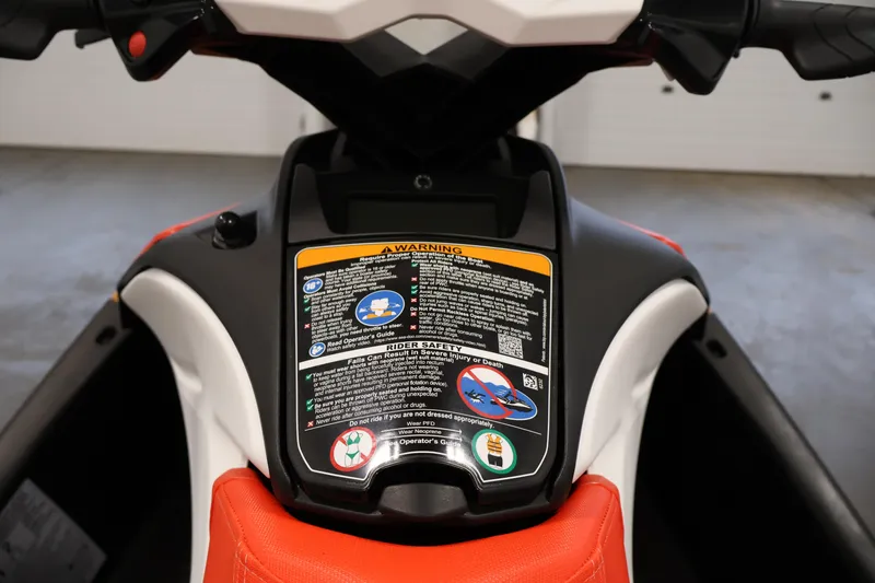 Slide: The Image of 2025 Sea-Doo Spark 2up dashboard with safety instructions and warning labels. - 12