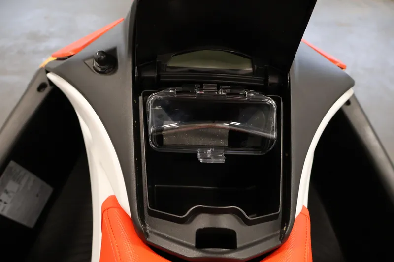 Slide: The Image of 2025 Sea-Doo Spark 2up storage compartment with open lid, showcasing interior details. - 13