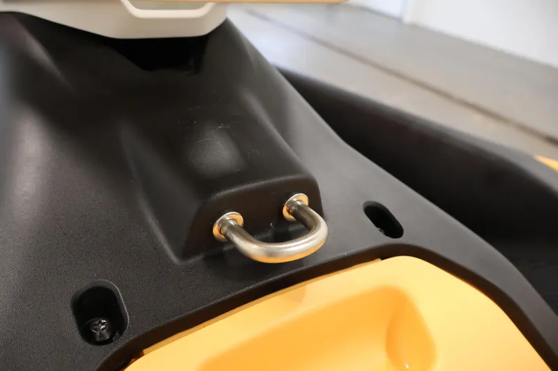 Slide: The Image of Close-up of 2025 Sea-Doo Spark 2up's tow hook on black and yellow body. - 16