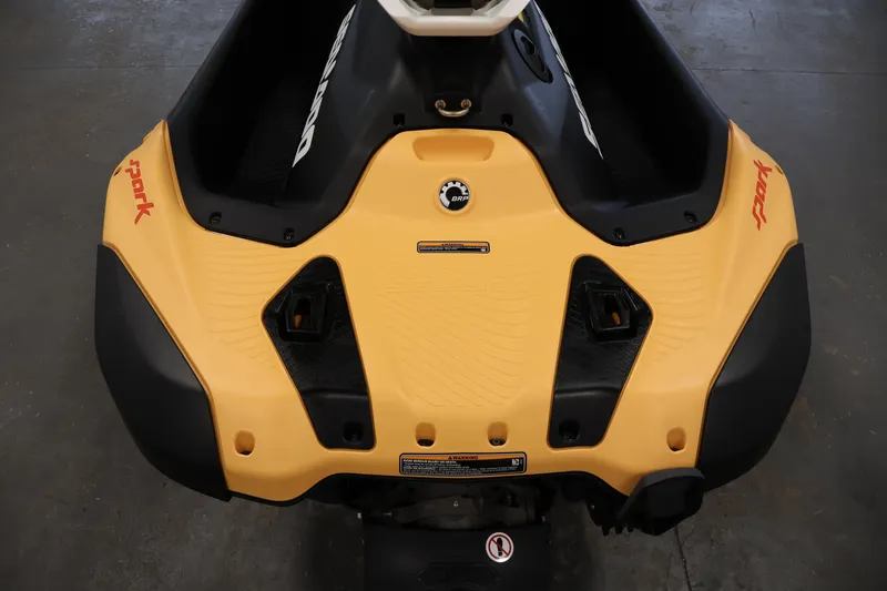 Slide: The Image of 2025 Sea-Doo Spark 2up, yellow and black rear view, showcasing sleek design. - 17