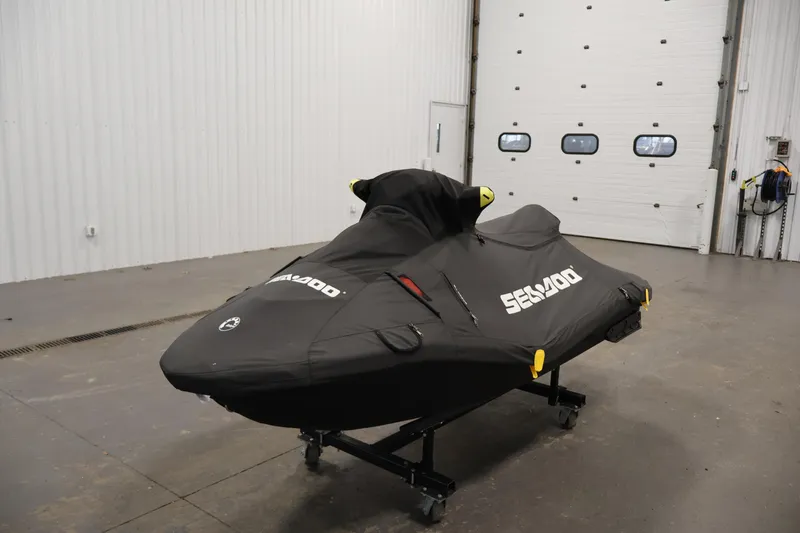 Slide: The Image of 2025 Sea-Doo Spark 2up jet ski covered in a garage setting. - 20