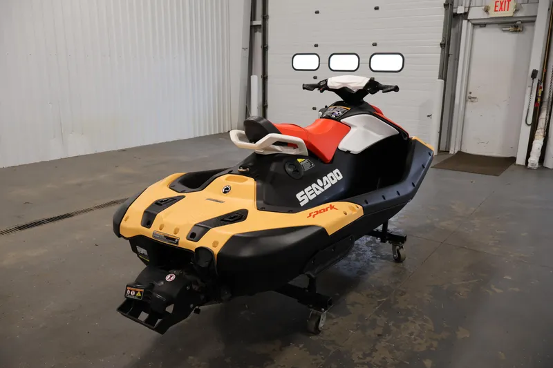 Slide: The Image of 2025 Sea-Doo Spark 2up jet ski in a garage setting. - 5
