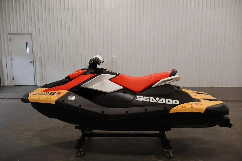 Slide: The Image of 2025 Sea-Doo Spark 2up jet ski in a showroom, featuring vibrant colors and sleek design. - 8