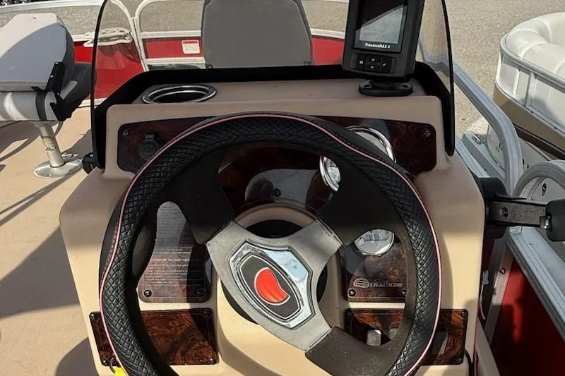 Slide: The Image of 2014 Sun Tracker Bass Buggy 18 DLX steering console with GPS and cup holder. - 11