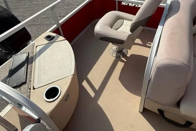 Slide: The Image of 2014 Sun Tracker Bass Buggy 18 DLX interior with seating and console. - 12