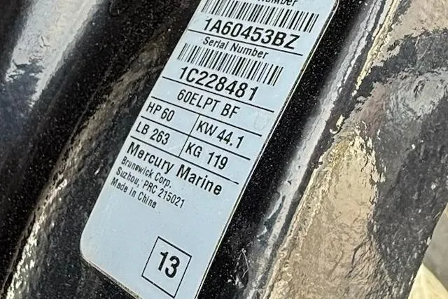 Slide: The Image of Label on Mercury Marine engine, showing serial number and specifications for Sun Tracker Bass Buggy 18 DLX. - 14