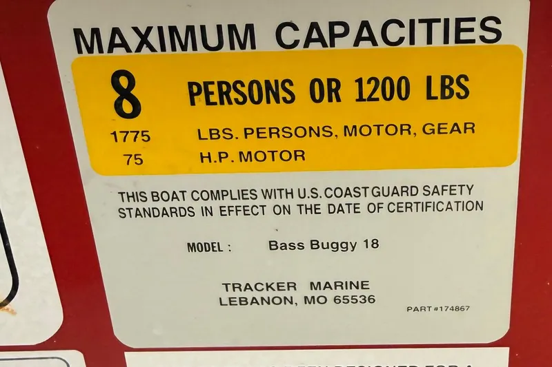 Slide: The Image of 2014 Sun Tracker Bass Buggy 18 DLX capacity label, 8 persons or 1200 lbs, U.S. Coast Guard compliant. - 15