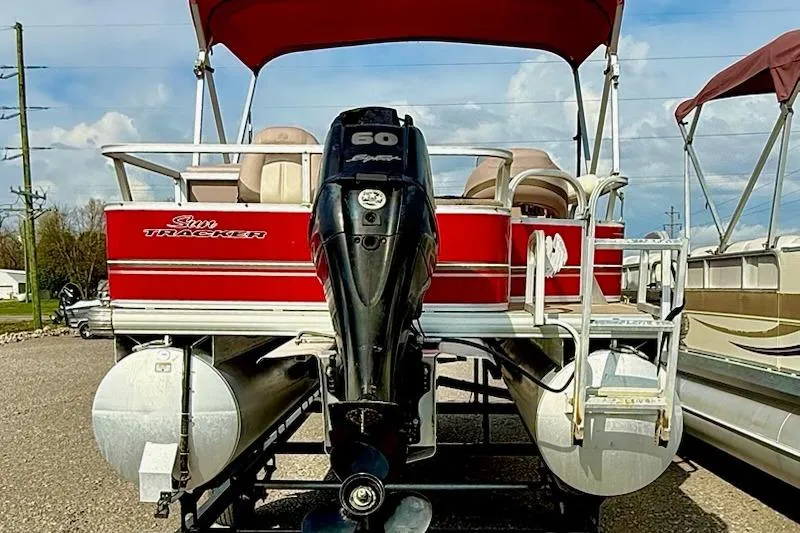 Slide: The Image of 2014 Sun Tracker Bass Buggy 18 DLX pontoon boat with red canopy and 60 HP motor. - 4