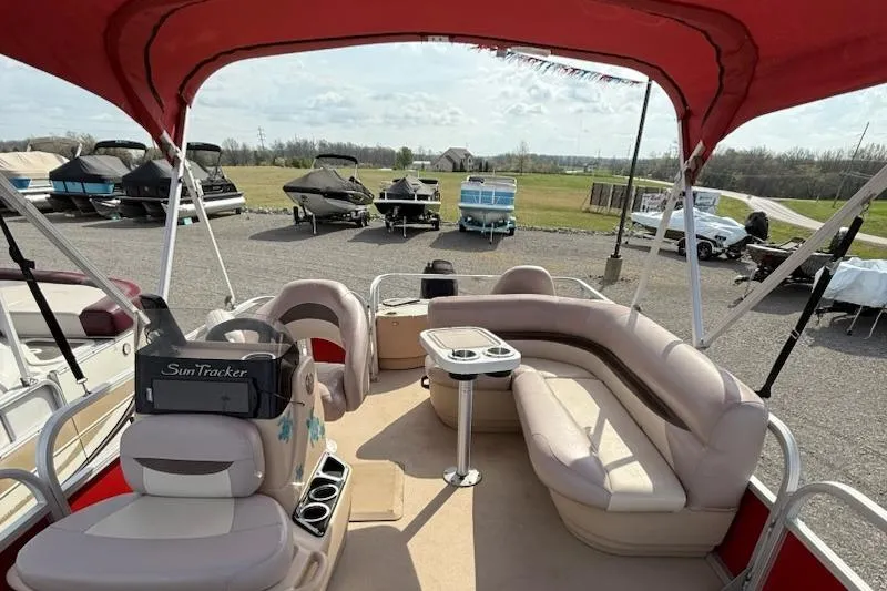 Slide: The Image of 2014 Sun Tracker Bass Buggy 18 DLX pontoon boat with spacious seating and canopy. - 9