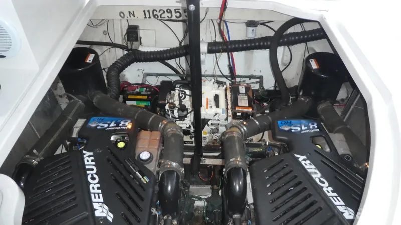 Slide: The Image of Engine compartment of a 2004 Larson 370 boat with dual Mercury engines. - 29