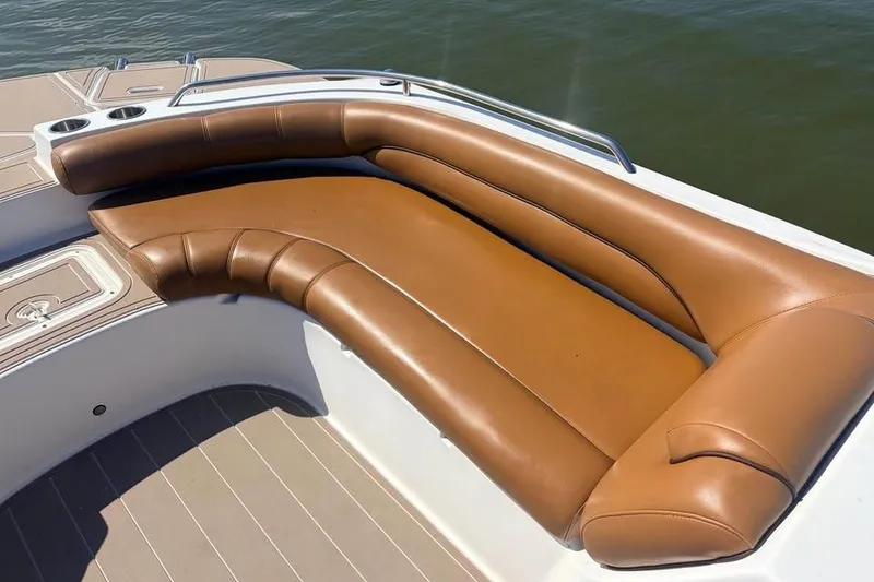 Slide: The Image of 2014 Hurricane SunDeck Sport 201 OB boat with tan leather seating, cup holders, and water view. - 4