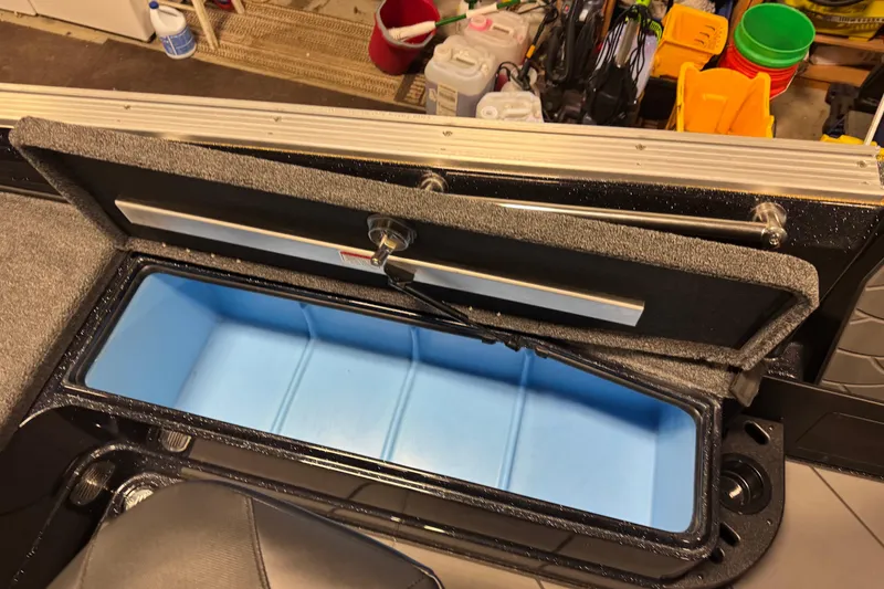 Slide: The Image of Open storage compartment in 2026 Nitro ZV21 boat, showcasing interior design. - 11