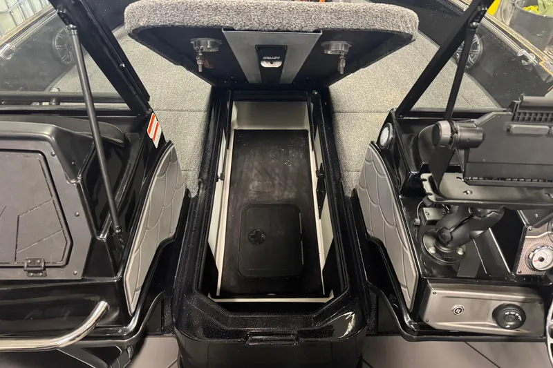 Slide: The Image of 2026 Nitro ZV21 boat interior with open storage compartment and control panel. - 14