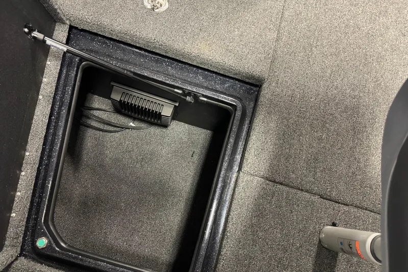 Slide: The Image of Carpeted storage compartment in 2026 Nitro ZV21 boat interior. - 19