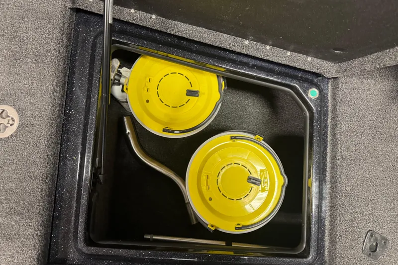 Slide: The Image of Storage compartment with yellow containers in a 2026 Nitro ZV21 boat. - 20