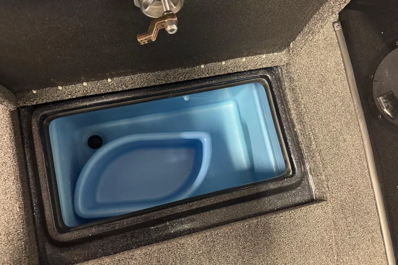 Slide: The Image of Built-in cooler compartment in 2026 Nitro ZV21 boat interior. - 21