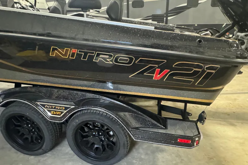 Slide: The Image of 2026 Nitro ZV21 boat on trailer, showcasing sleek design and branding. - 5