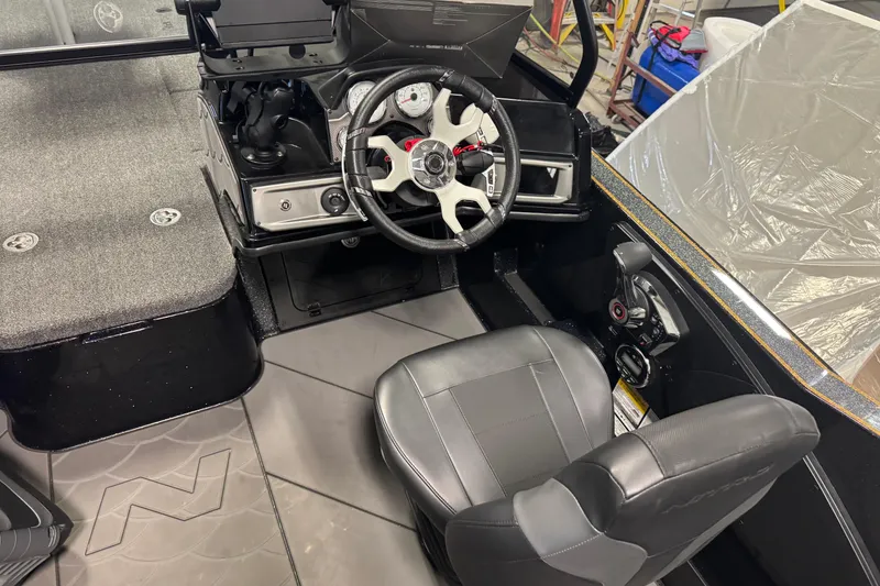 Slide: The Image of 2026 Nitro ZV21 boat interior with steering wheel and dashboard controls. - 6