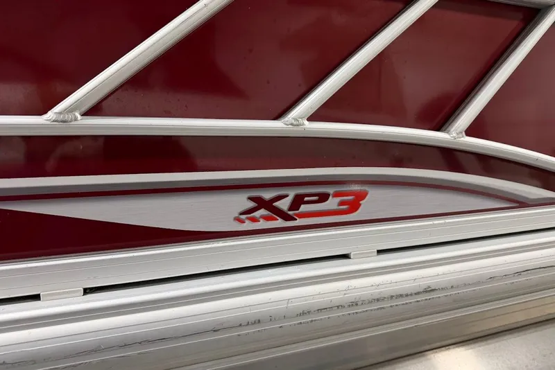 Slide: The Image of Red and silver detailing on 2022 SUNTRACKER 22 DLX XP3 boat. - 13