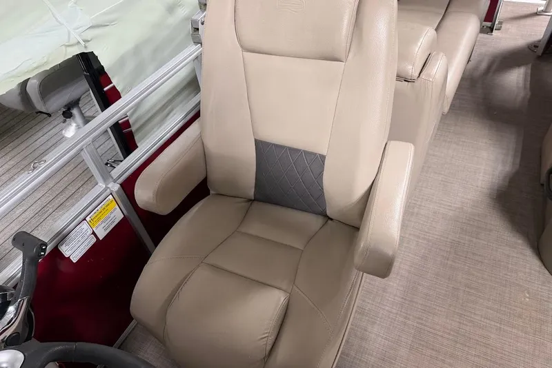 Slide: The Image of Beige captain's chair on 2022 SUNTRACKER 22 DLX pontoon boat interior. - 16