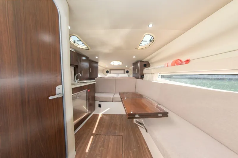 Slide: The Image of Interior of 2016 Regal 32 Express yacht with modern kitchen and seating area. - 26