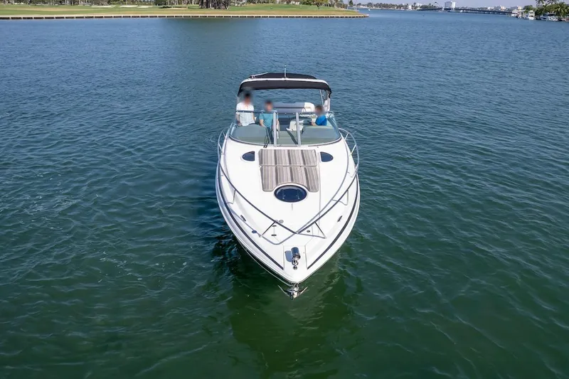 Slide: The Image of 2016 Regal 32 Express boat cruising on calm waters. - 3