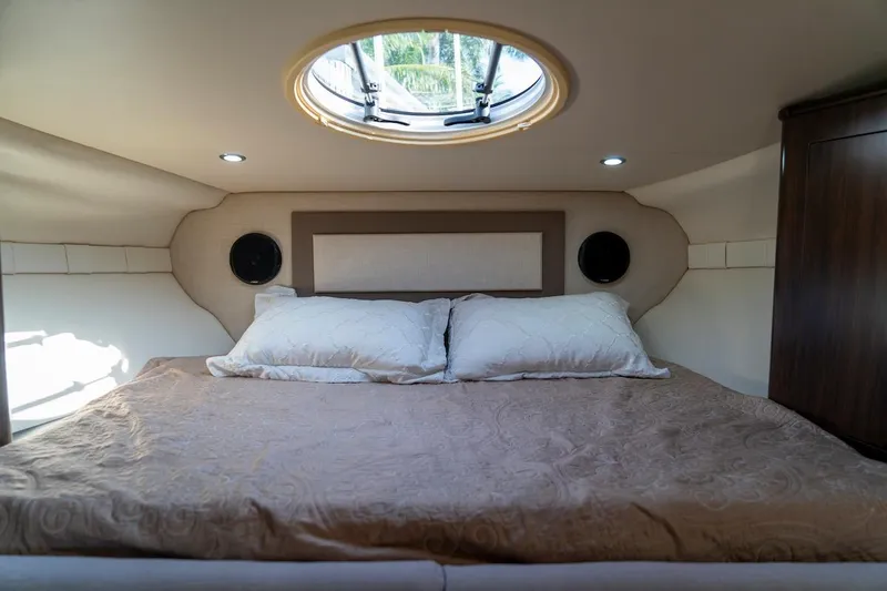 Slide: The Image of Luxurious cabin interior of 2016 Regal 32 Express yacht with cozy bedding. - 30