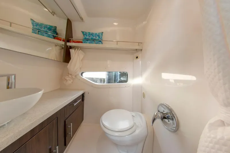 Slide: The Image of 2016 Regal 32 Express yacht bathroom with modern fixtures and sleek design. - 32