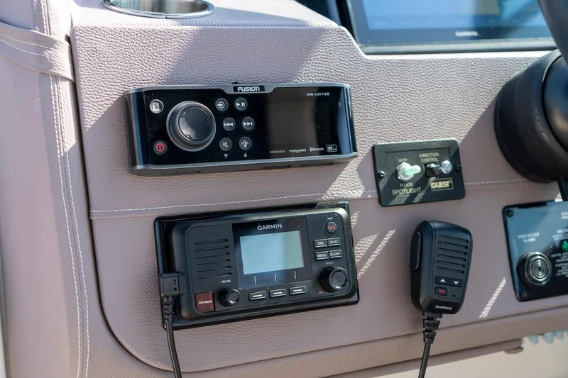 Slide: The Image of Control panel of a 2016 Regal 32 Express boat featuring Garmin and Fusion electronics. - 41