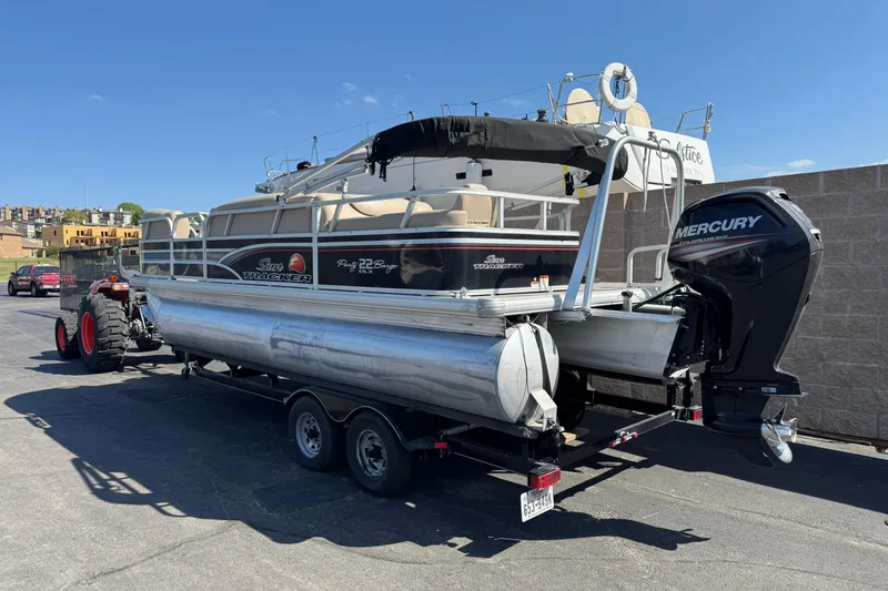 Slide: The Image of 2015 Sun Tracker Party Barge 220 DLX on trailer with Mercury outboard motor. - 3