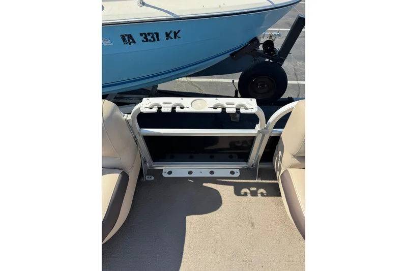 Slide: The Image of 2015 Sun Tracker Party Barge 220 DLX interior with seating and storage view. - 9