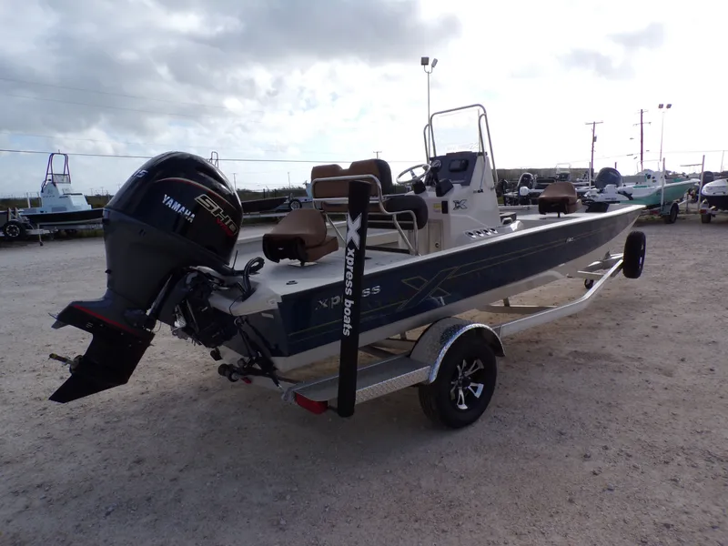 Slide: The Image of 2026 Xpress H20BAY boat with Yamaha engine on trailer. - 12