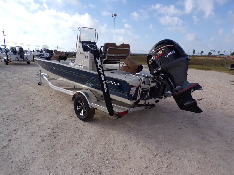 Slide: The Image of 2026 Xpress H20BAY boat with Yamaha engine on trailer. - 14