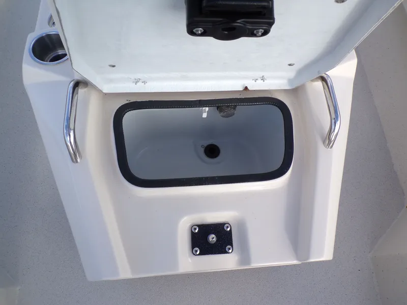 Slide: The Image of 2026 Xpress H20BAY boat compartment with open lid. - 16