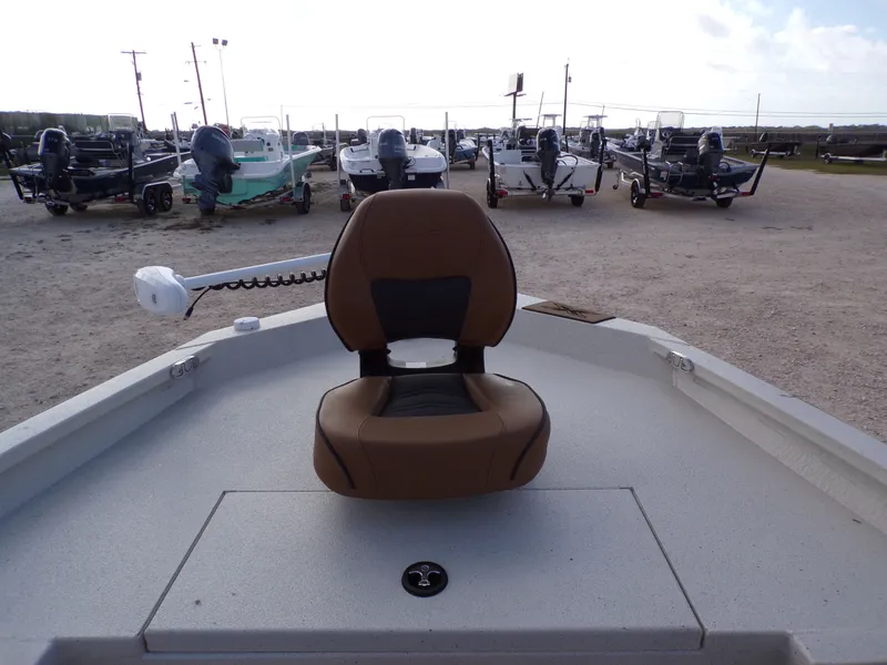 Slide: The Image of 2026 Xpress H20BAY boat with brown seat on deck. - 18