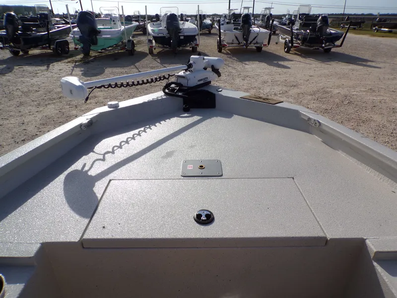 Slide: The Image of 2026 Xpress H20BAY boat with electric motor on gravel lot. - 19