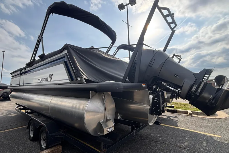 Slide: The Image of 2026 Viaggio Lago X24U pontoon boat with Suzuki outboard motor on trailer. - 5