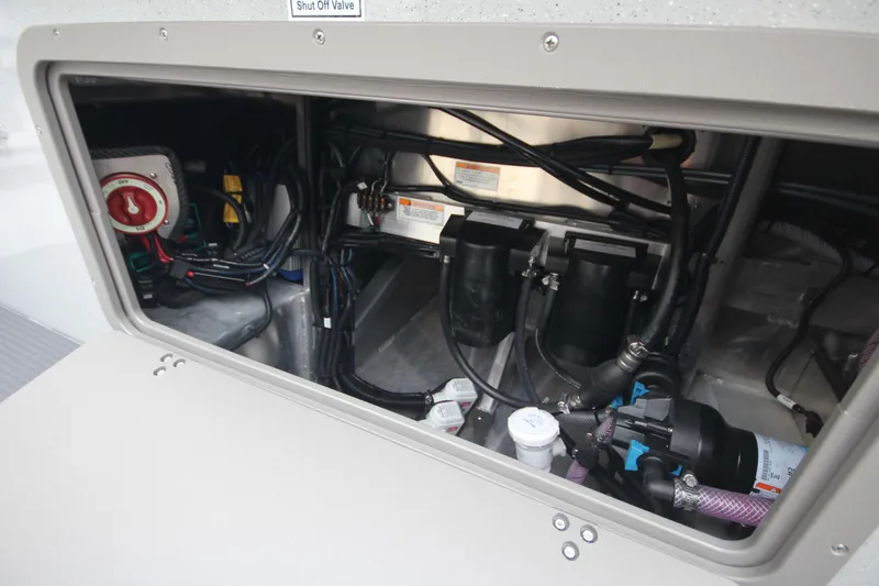 Slide: The Image of 2025 Weldcraft 240 Maverick DV engine compartment with wiring and components. - 14