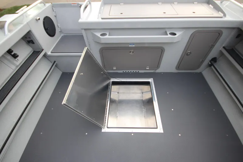 Slide: The Image of 2025 Weldcraft 240 Maverick DV boat interior with open storage compartment. - 15