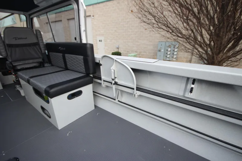 Slide: The Image of Interior of 2025 Weldcraft 240 Maverick DV boat, featuring seating and storage. - 16