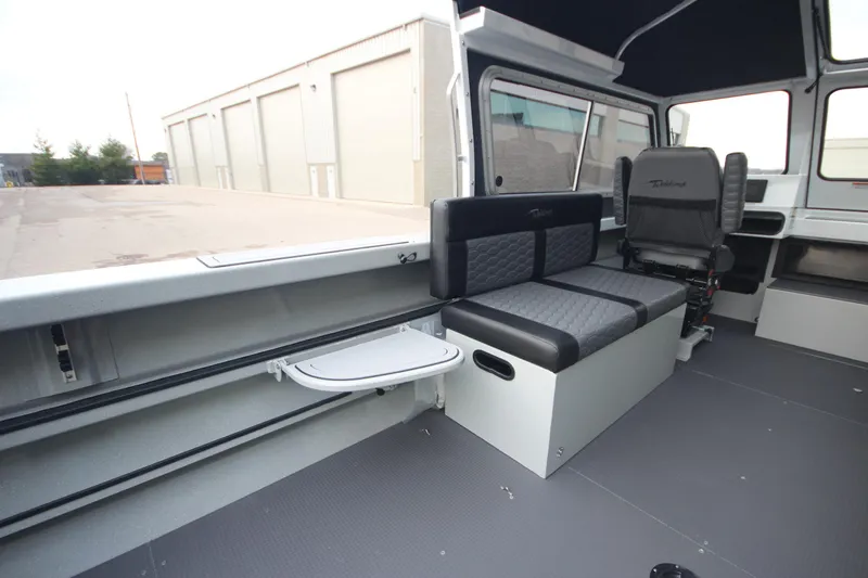 Slide: The Image of Interior of 2025 Weldcraft 240 Maverick DV boat, featuring seating and modern design. - 17