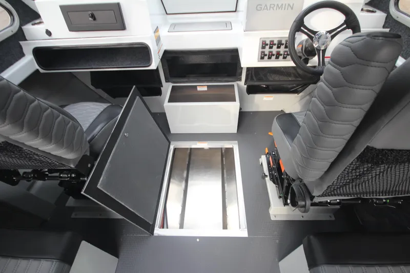 Slide: The Image of Interior of 2025 Weldcraft 240 Maverick DV boat with modern seating and controls. - 18