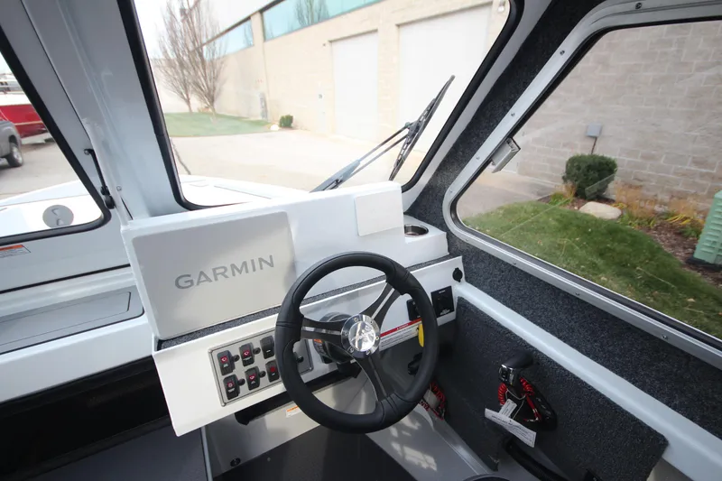 Slide: The Image of 2025 Weldcraft 240 Maverick DV boat interior with Garmin navigation system. - 22