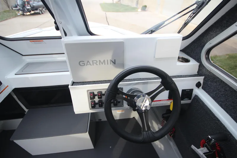 Slide: The Image of 2025 Weldcraft 240 Maverick DV boat cockpit with Garmin navigation system. - 23