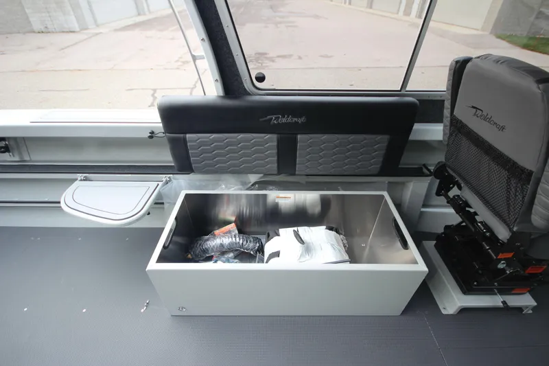 Slide: The Image of Interior of 2025 Weldcraft 240 Maverick DV boat with storage compartment open. - 26