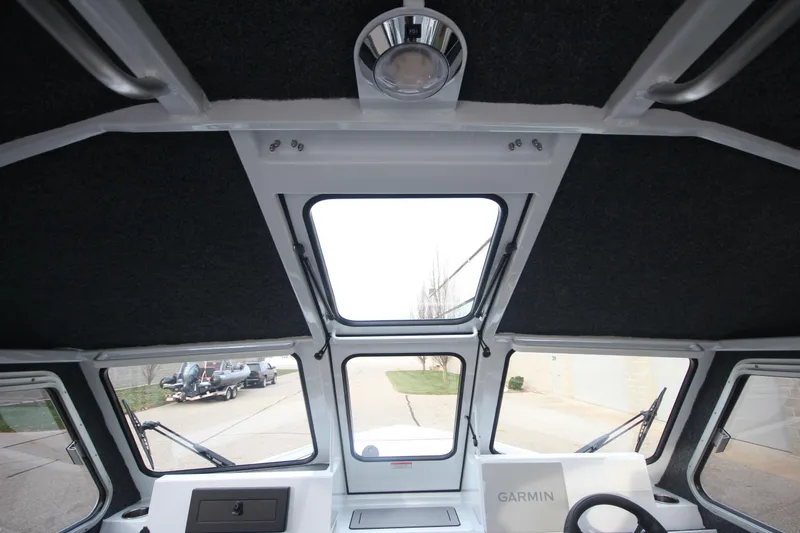 Slide: The Image of Interior view of 2025 Weldcraft 240 Maverick DV boat with Garmin navigation system. - 28